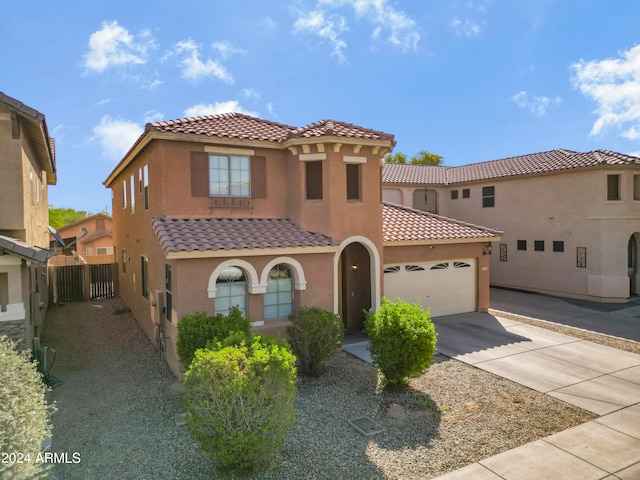 mediterranean / spanish house featuring a garage