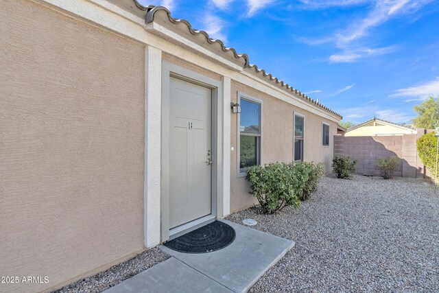5769 E Good Pasture Ln, Florence, AZ 85132 - doorway to property with stucco siding