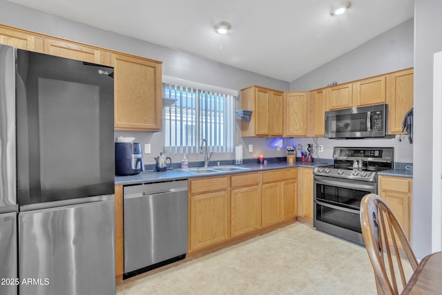 5769 E Good Pasture Ln, Florence, AZ 85132 - kitchen featuring stainless steel appliances, lofted ceiling, light brown cabinets, dark countertops, and light flooring