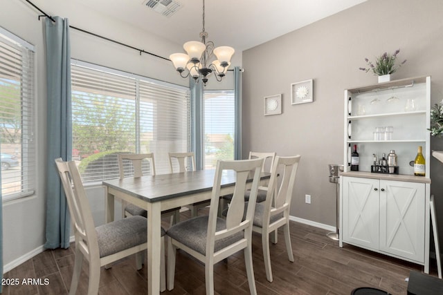3719 E Sandy Way, Gilbert, AZ 85297 - dining area featuring a chandelier, dark wood-type flooring, and healthy amount of natural light