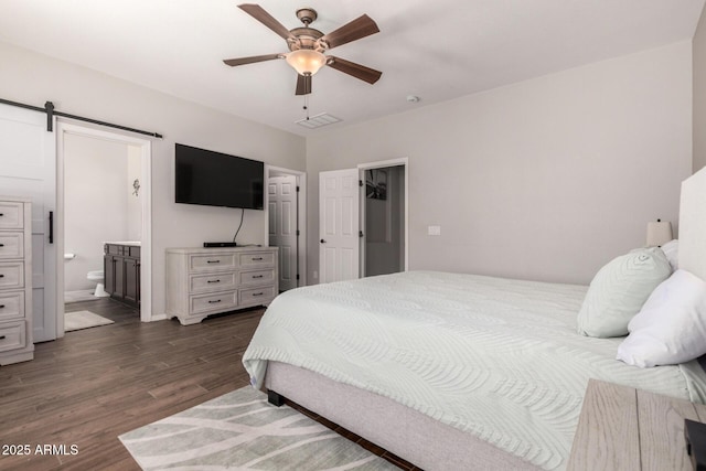 3719 E Sandy Way, Gilbert, AZ 85297 - bedroom featuring dark wood finished floors, a barn door, ensuite bathroom, and a ceiling fan