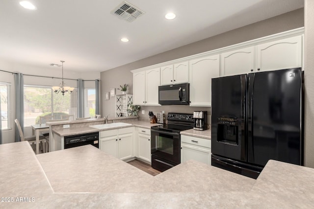 3719 E Sandy Way, Gilbert, AZ 85297 - kitchen featuring black appliances, a chandelier, recessed lighting, light countertops, and white cabinets