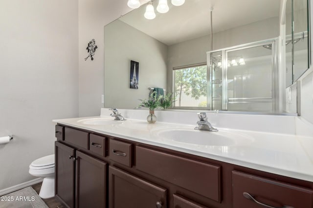 3719 E Sandy Way, Gilbert, AZ 85297 - bathroom featuring double vanity and a shower with shower door