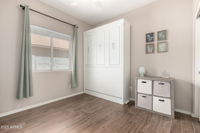 3719 E Sandy Way, Gilbert, AZ 85297 - unfurnished bedroom featuring wood finished floors and ceiling fan