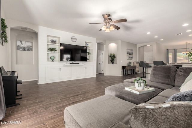 3719 E Sandy Way, Gilbert, AZ 85297 - living area featuring arched walkways, ceiling fan, dark wood-type flooring, and recessed lighting