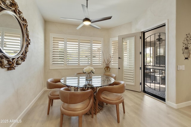 dining room featuring light hardwood / wood-style flooring and ceiling fan