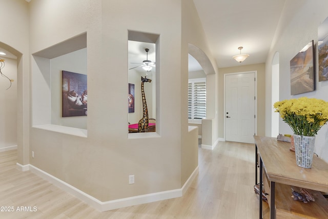 entrance foyer featuring ceiling fan and hardwood / wood-style floors