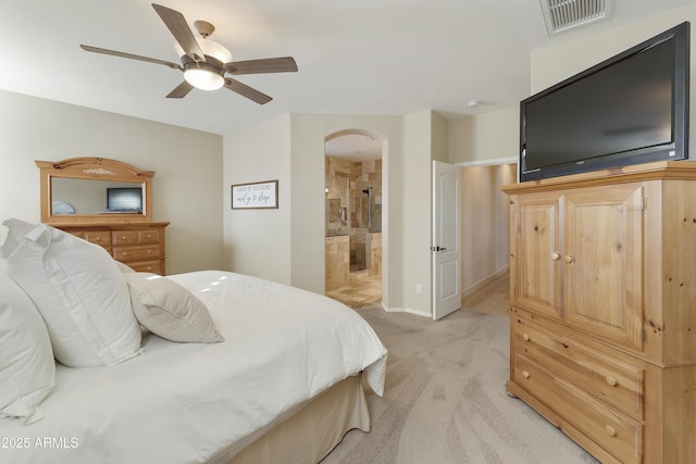 carpeted bedroom with connected bathroom and ceiling fan