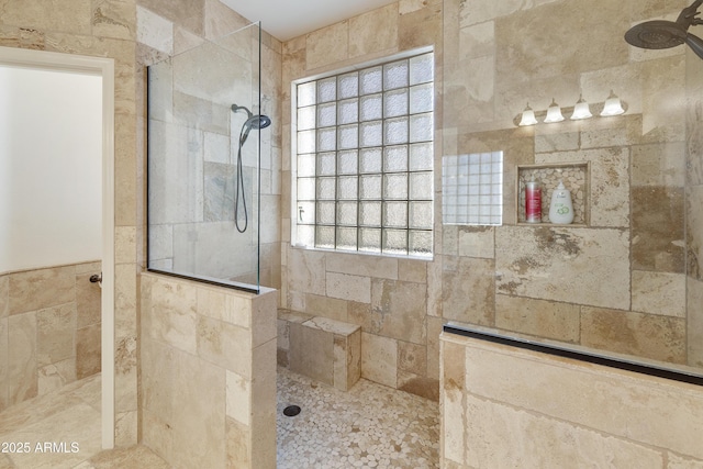 bathroom with tiled shower