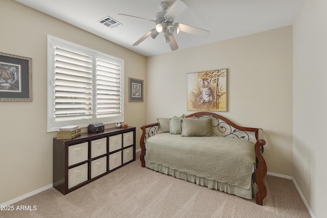 bedroom with light carpet and ceiling fan