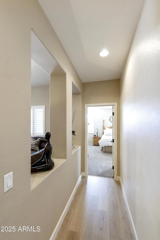 hallway featuring light hardwood / wood-style flooring