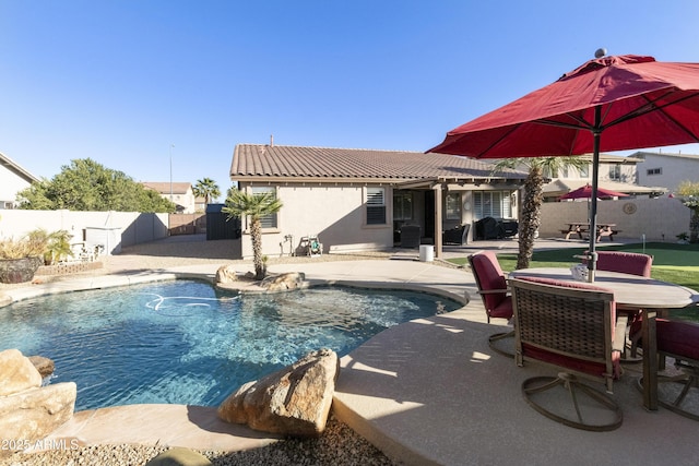 view of swimming pool with a patio area