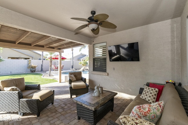 view of patio / terrace featuring an outdoor living space, a fenced in pool, and ceiling fan