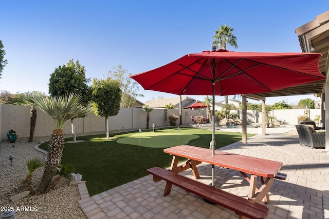 surrounding community featuring a patio