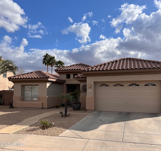 mediterranean / spanish-style home featuring a garage