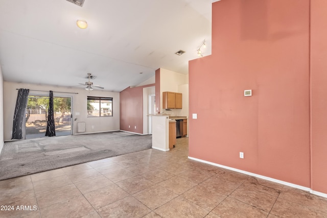 interior space with ceiling fan, light tile patterned flooring, and lofted ceiling