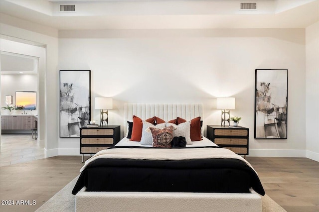 bedroom with wood-type flooring