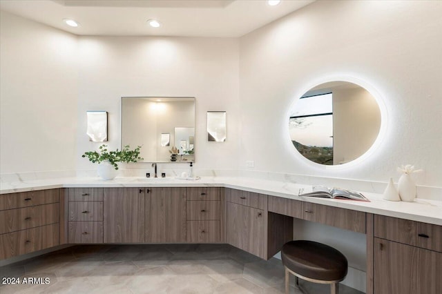 bathroom with tile patterned flooring and vanity