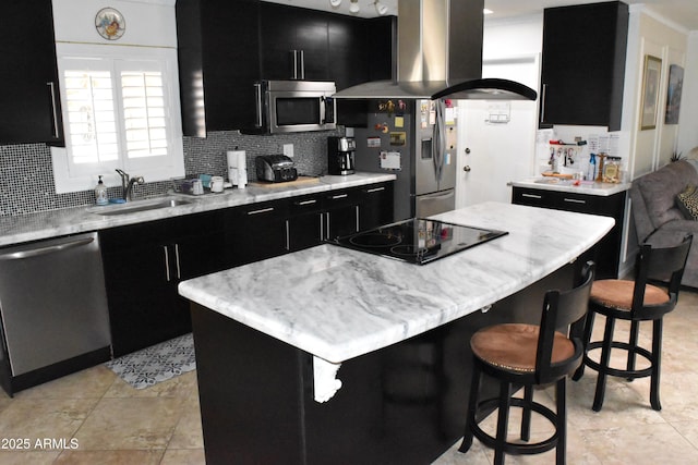 kitchen featuring stainless steel appliances, dark cabinetry, a sink, and ventilation hood