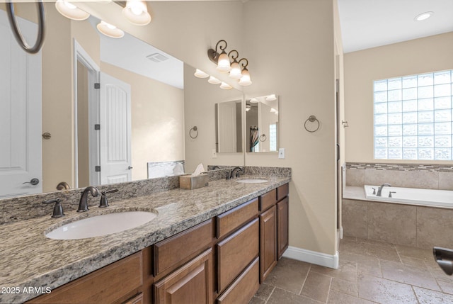 bathroom with vanity and a relaxing tiled tub