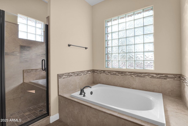 bathroom with separate shower and tub