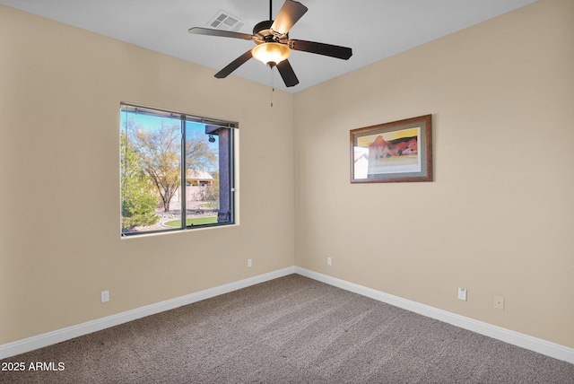 carpeted spare room with ceiling fan