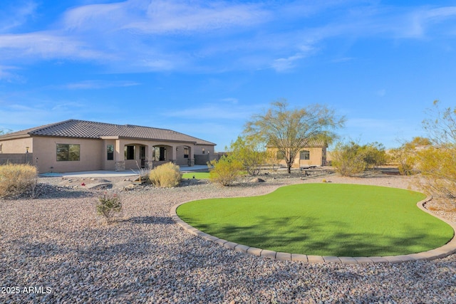 rear view of property with a patio area