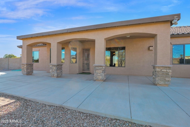 back of property featuring a patio area