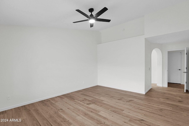 spare room featuring light wood-type flooring and ceiling fan