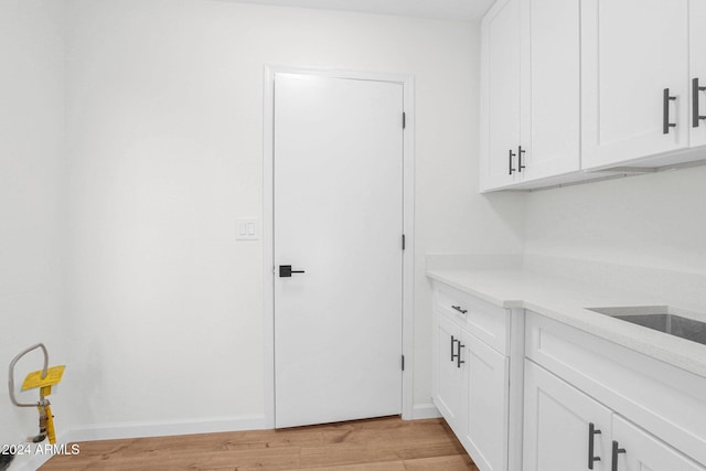 washroom with light hardwood / wood-style floors