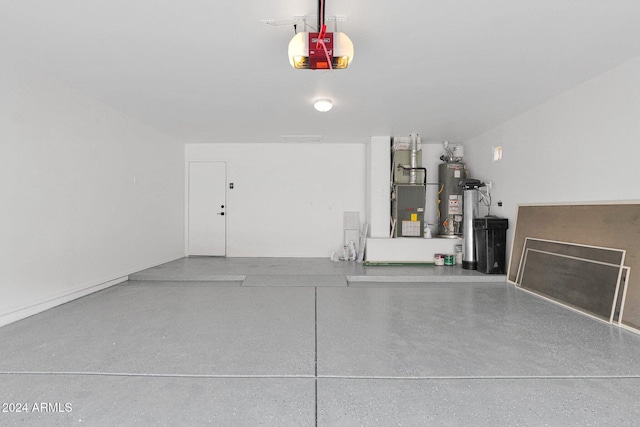 garage featuring heating unit, water heater, and a garage door opener