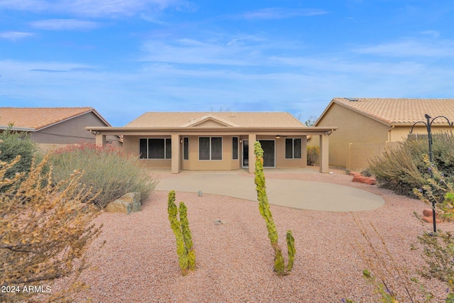 back of property with a patio area