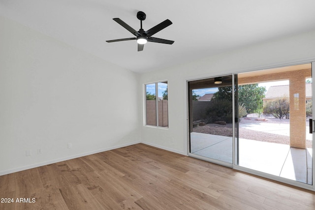 unfurnished room with ceiling fan, a healthy amount of sunlight, and light wood-type flooring