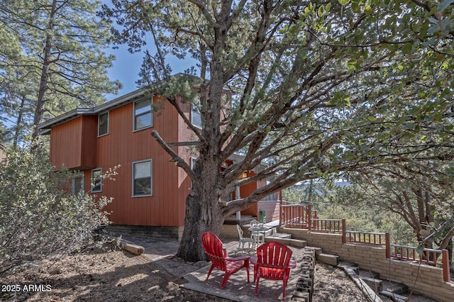 view of property exterior with a patio