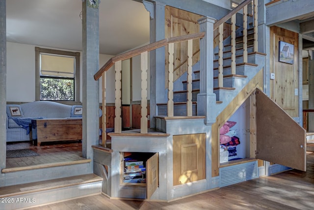 stairway featuring wood finished floors