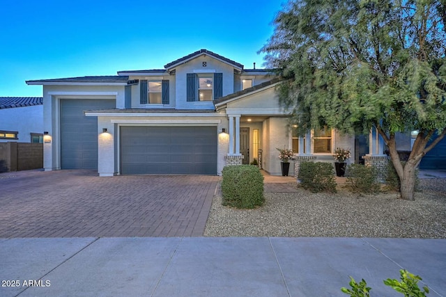 view of front of home featuring decorative driveway