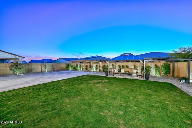 view of yard with a gazebo, a patio area, and a fenced backyard