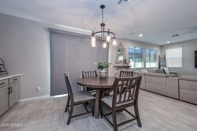 dining space featuring recessed lighting, light wood-type flooring, visible vents, and baseboards