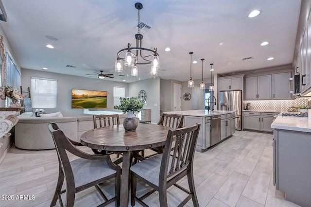 dining room with a healthy amount of sunlight, visible vents, and recessed lighting