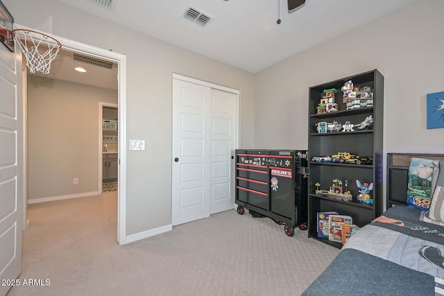 bedroom with carpet, a closet, visible vents, and baseboards