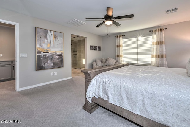 carpeted bedroom featuring baseboards, visible vents, ceiling fan, and ensuite bathroom