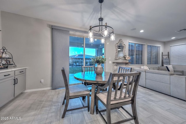 dining room with recessed lighting, light wood-type flooring, visible vents, and baseboards