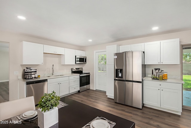 556 S Forest, Mesa, AZ 85204 - kitchen featuring appliances with stainless steel finishes, dark wood-type flooring, light countertops, white cabinetry, and recessed lighting