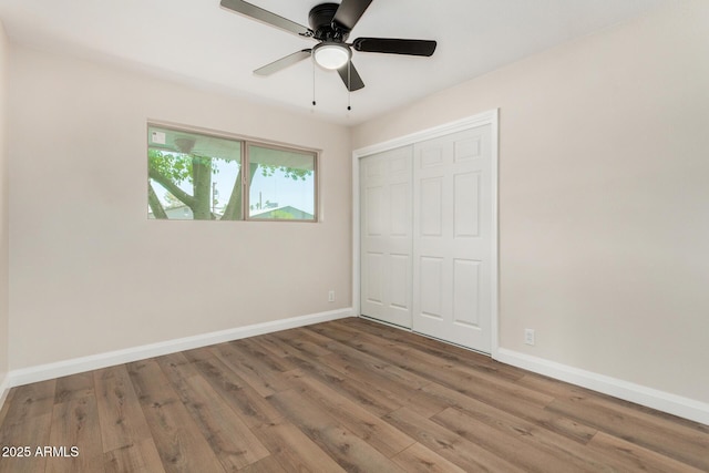 556 S Forest, Mesa, AZ 85204 - unfurnished bedroom featuring wood finished floors, a closet, and ceiling fan