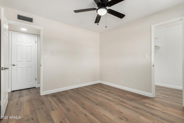556 S Forest, Mesa, AZ 85204 - spare room with a ceiling fan and wood finished floors