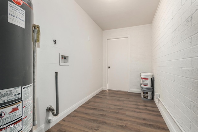 556 S Forest, Mesa, AZ 85204 - washroom with water heater, washer hookup, dark wood finished floors, and brick wall