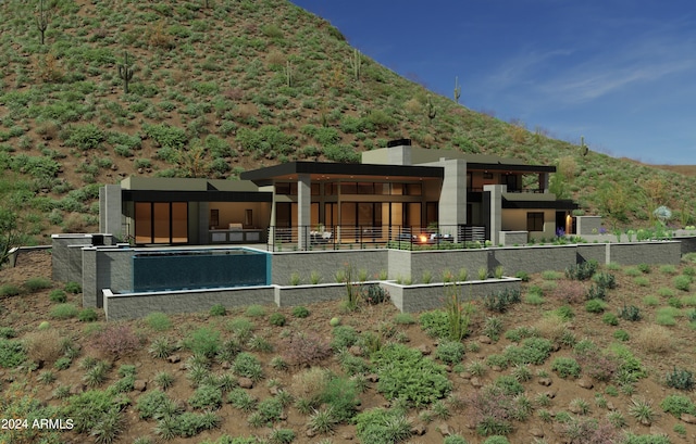 rear view of property featuring a mountain view