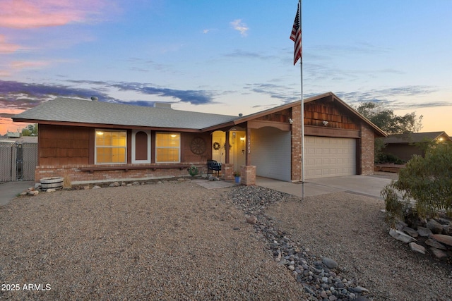 single story home featuring fence, an attached garage, brick siding, a porch, and driveway