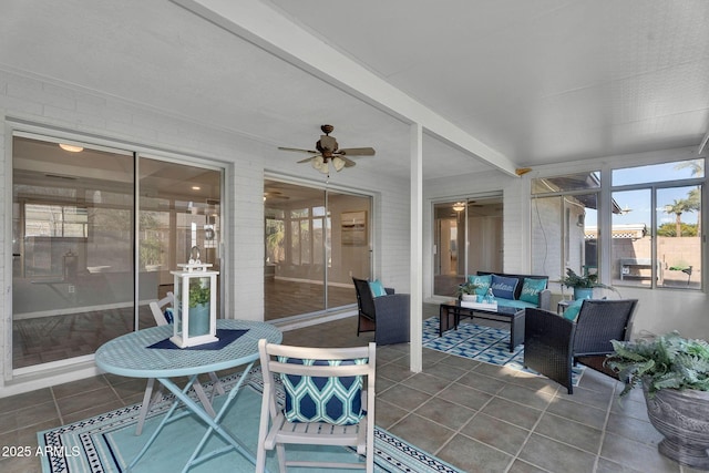sunroom with an outdoor hangout area, ceiling fan, and a wealth of natural light