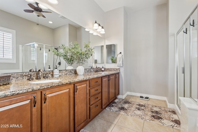 bathroom featuring an enclosed shower, tile patterned flooring, ceiling fan, and vanity